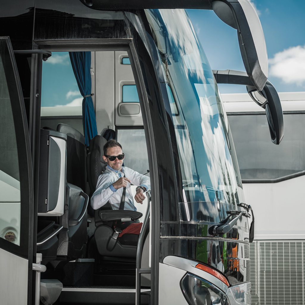 rent-a-bus-driver-pointing-at-wrist-watch rent a bus driver pointing at wrist watch