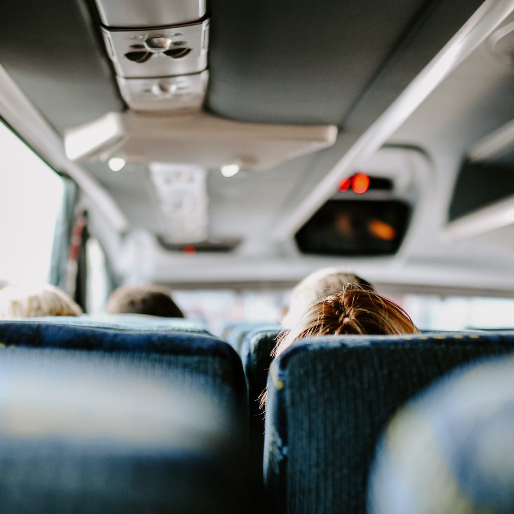 Picture inside of a bus with some people